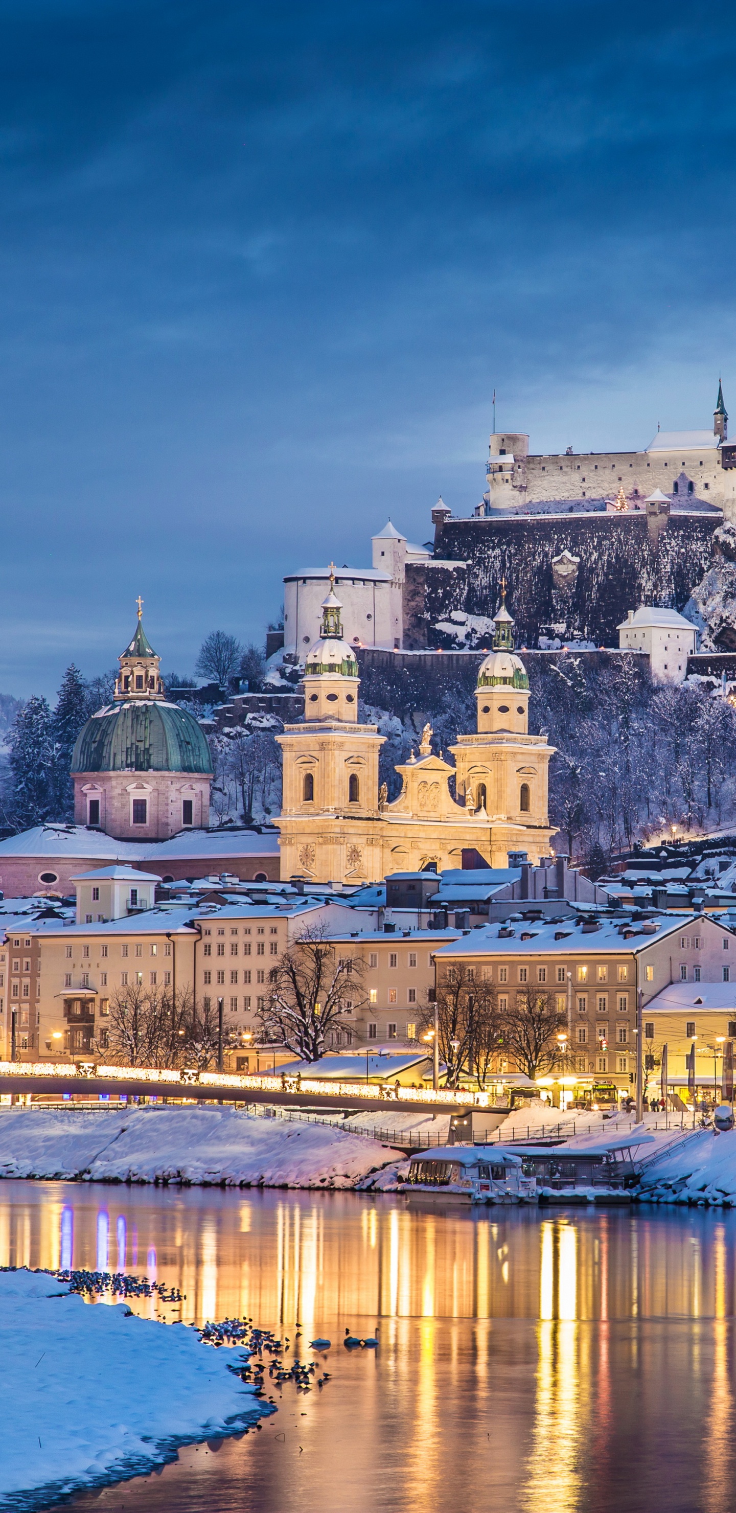 White and Brown Concrete Building Near Body of Water During Daytime. Wallpaper in 1440x2960 Resolution