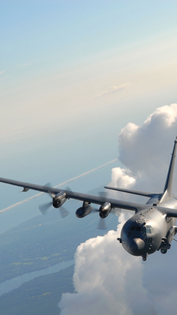 Gray Airplane Flying Over White Clouds During Daytime. Wallpaper in 720x1280 Resolution