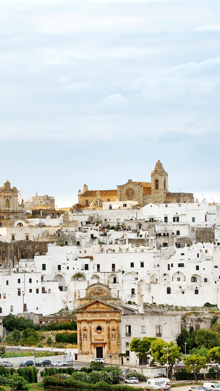 White Concrete Building Under Blue Sky During Daytime. Wallpaper in 750x1334 Resolution