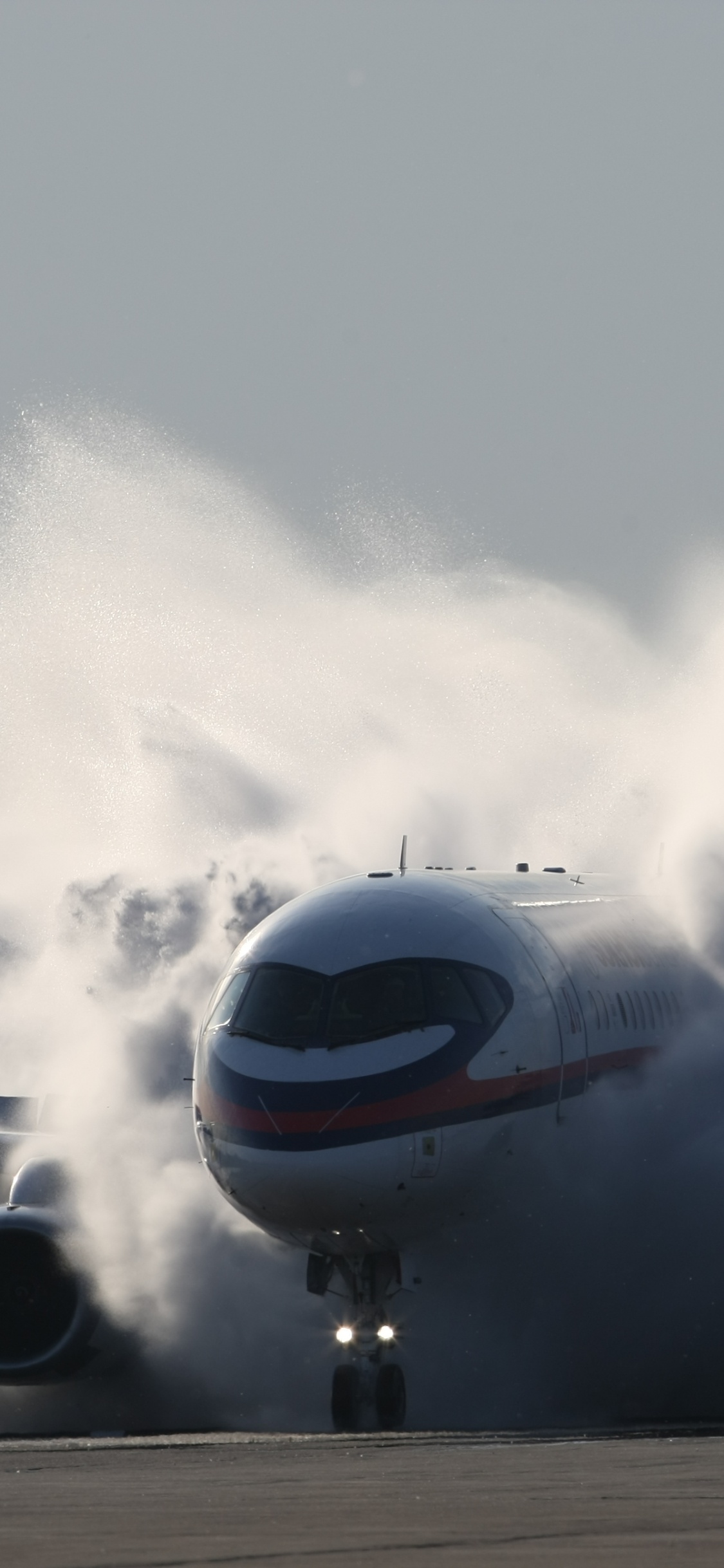 White and Red Airplane on Air During Daytime. Wallpaper in 1125x2436 Resolution