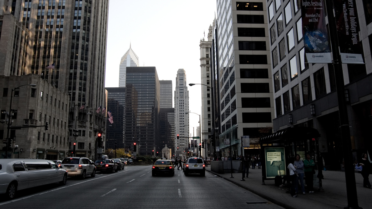 Cars on Road Between High Rise Buildings During Daytime. Wallpaper in 1280x720 Resolution
