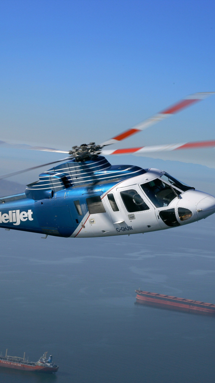 Blue and White Airplane on Mid Air During Daytime. Wallpaper in 750x1334 Resolution