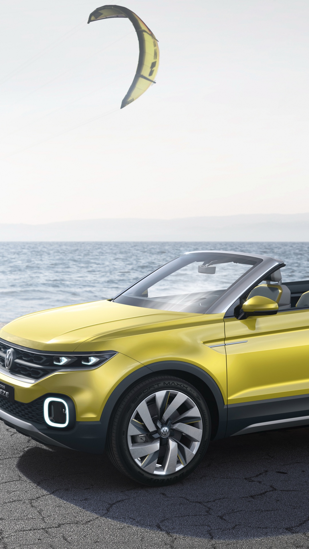 Yellow Convertible Car on Gray Concrete Road During Daytime. Wallpaper in 1080x1920 Resolution