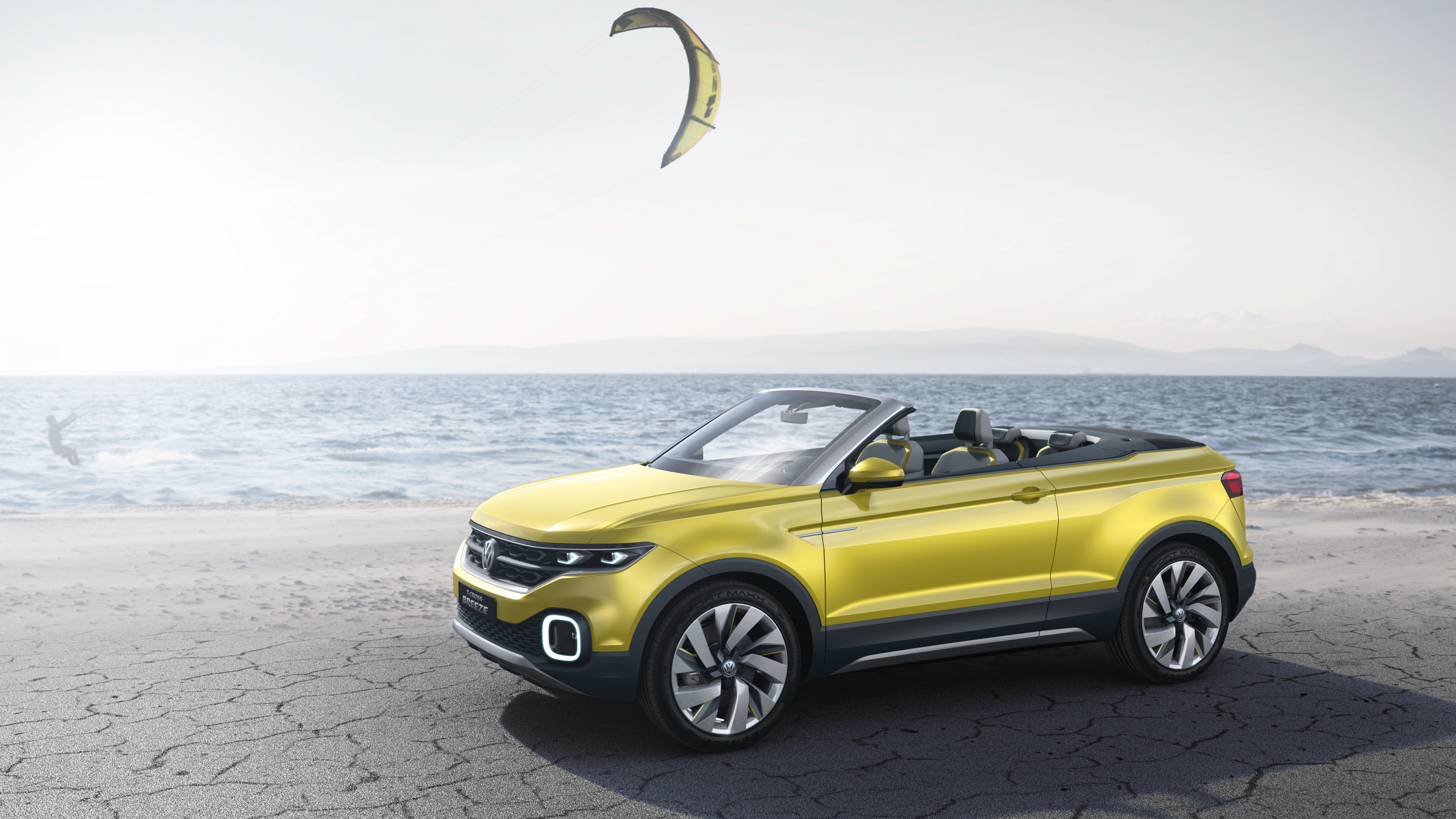 Yellow Convertible Car on Gray Concrete Road During Daytime. Wallpaper in 2560x1440 Resolution