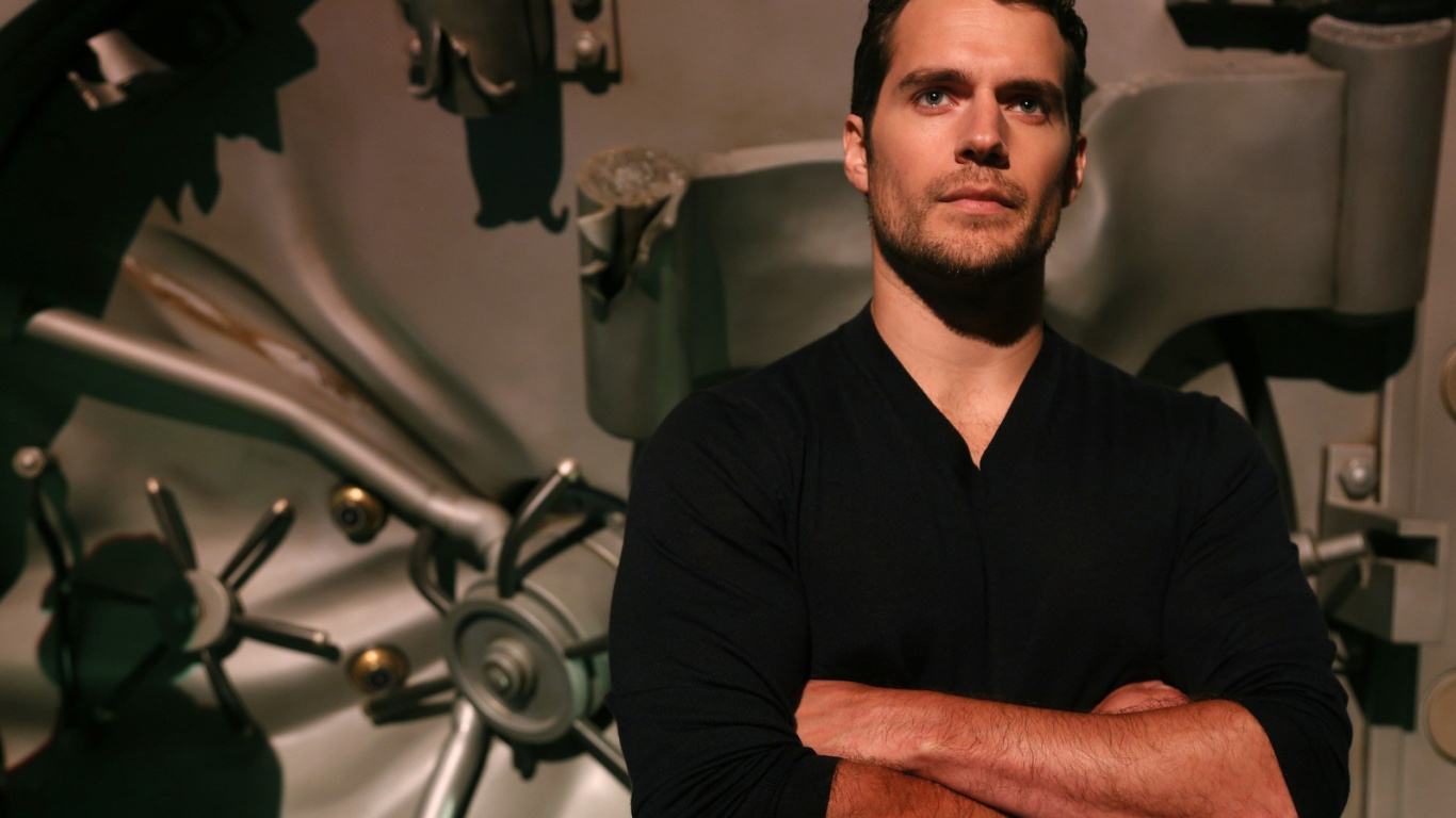 Man in Black Polo Shirt Sitting on Black Chair. Wallpaper in 1366x768 Resolution