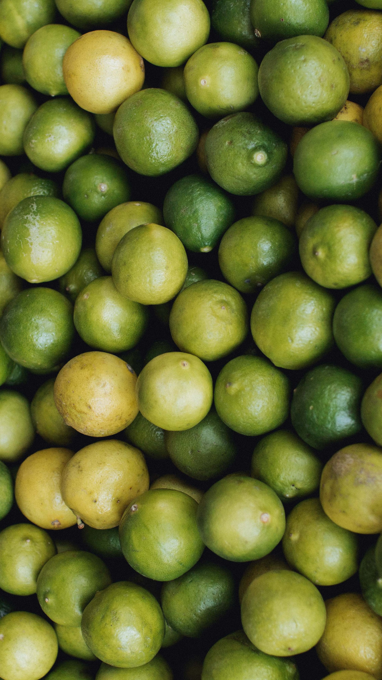 Green and Yellow Round Fruits. Wallpaper in 750x1334 Resolution