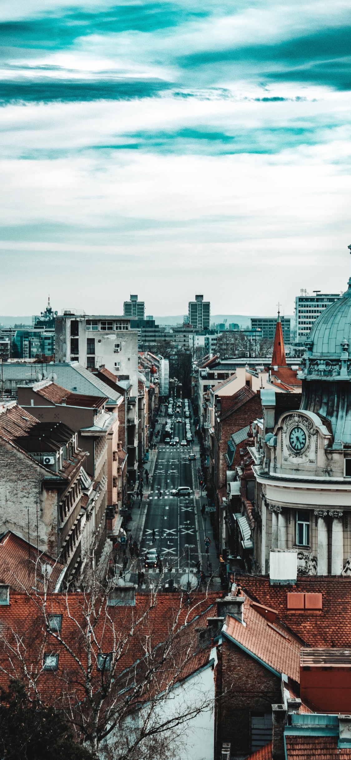 Brown and White Concrete Buildings Under White Clouds and Blue Sky During Daytime. Wallpaper in 1125x2436 Resolution