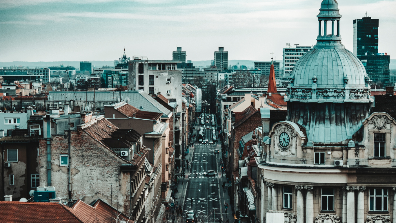Brown and White Concrete Buildings Under White Clouds and Blue Sky During Daytime. Wallpaper in 1366x768 Resolution