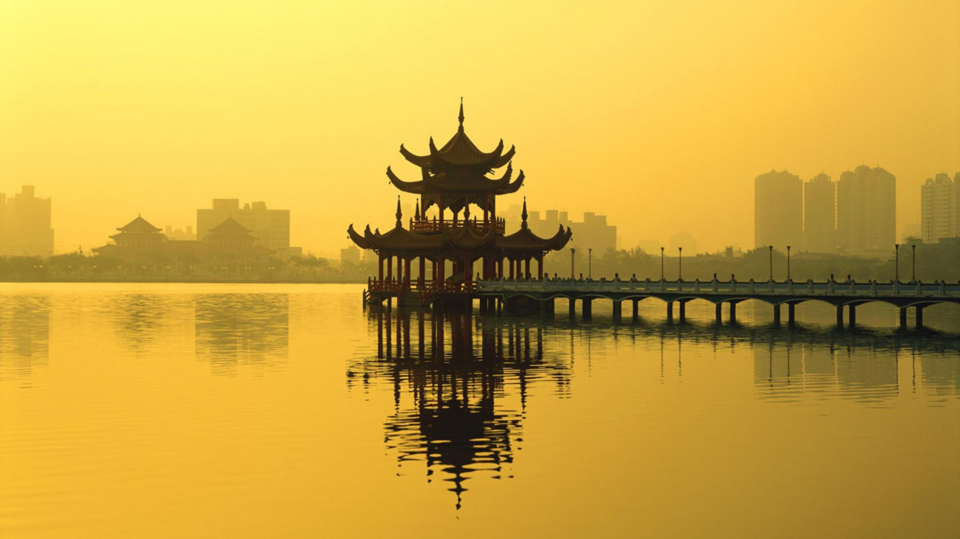 Silhouette of Building Near Body of Water During Sunset. Wallpaper in 1366x768 Resolution