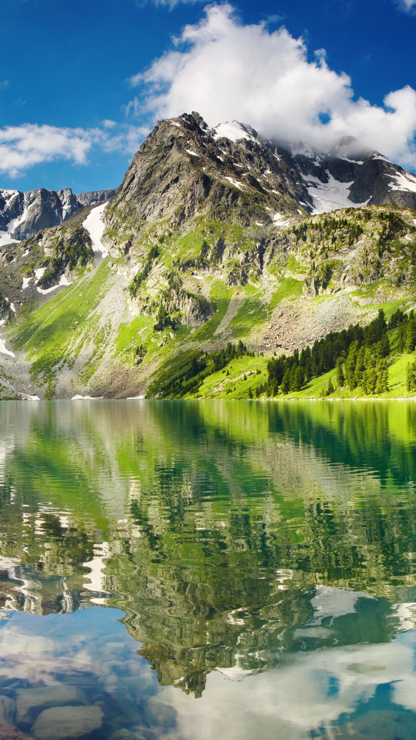 Green and White Mountains Near Lake Under Blue Sky During Daytime. Wallpaper in 1440x2560 Resolution