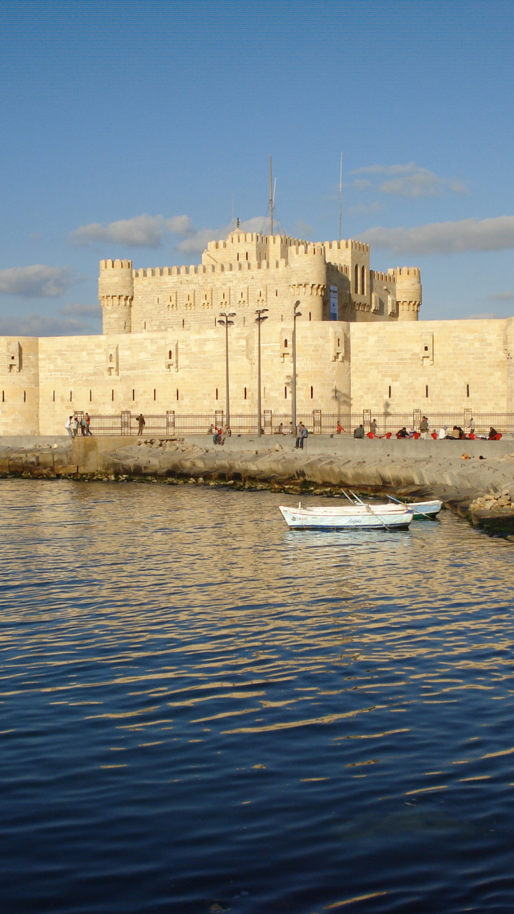 White Boat on Body of Water Near Concrete Building During Daytime. Wallpaper in 750x1334 Resolution