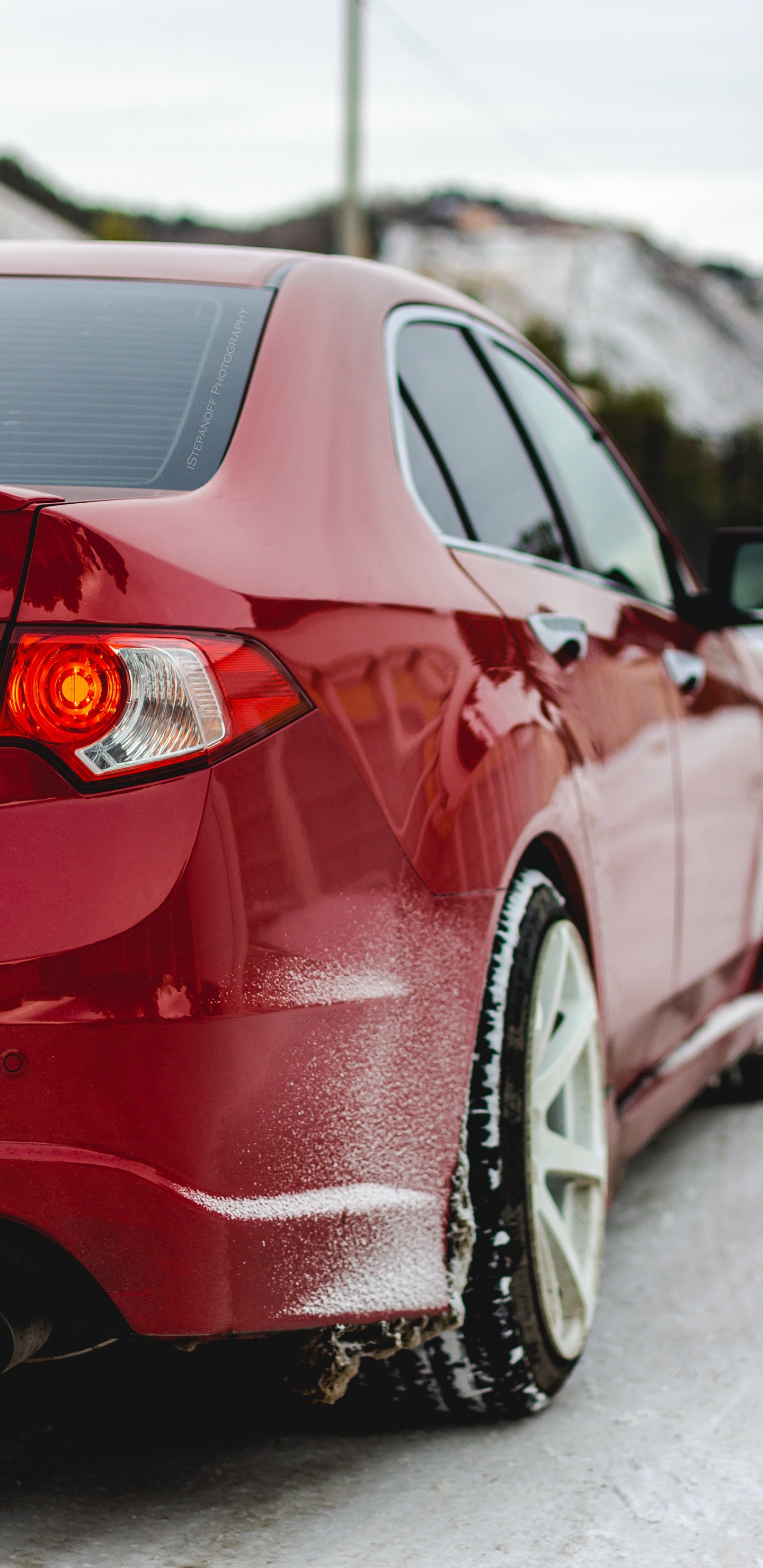 Red Car on Snow Covered Ground During Daytime. Wallpaper in 1440x2960 Resolution