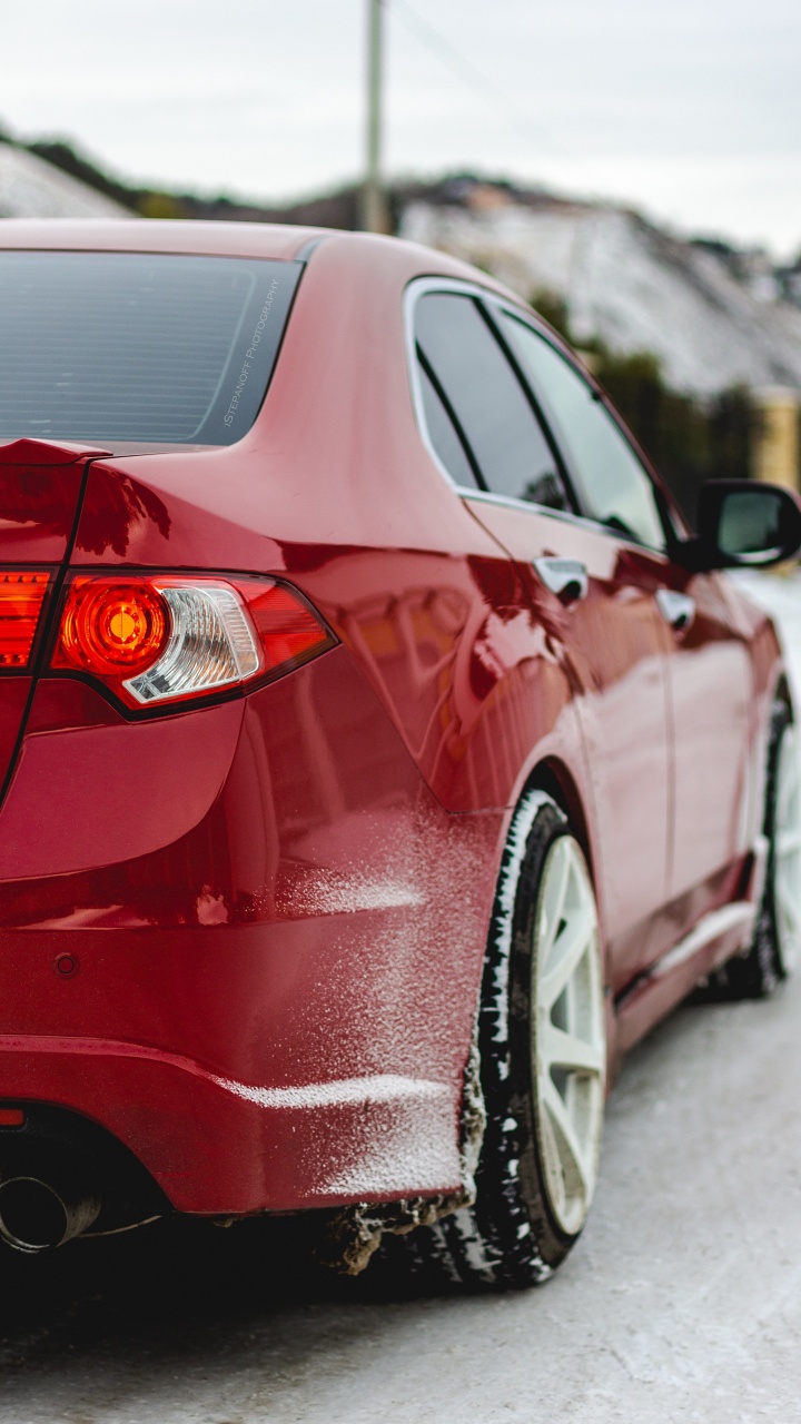 Red Car on Snow Covered Ground During Daytime. Wallpaper in 720x1280 Resolution