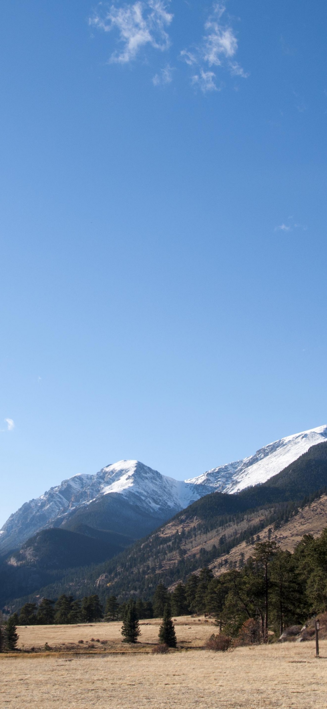 Green Trees and Mountains Under Blue Sky During Daytime. Wallpaper in 1125x2436 Resolution