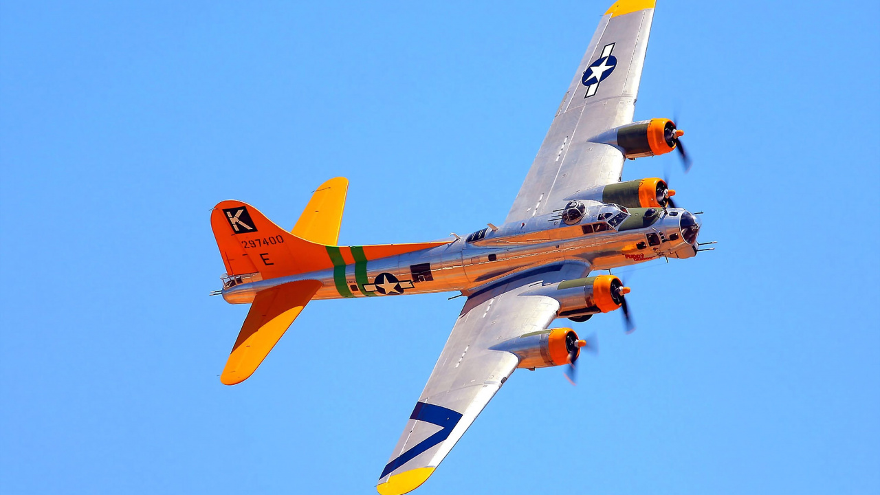 Avión de Reacción Naranja y Amarillo en el Aire Durante el Día. Wallpaper in 1280x720 Resolution