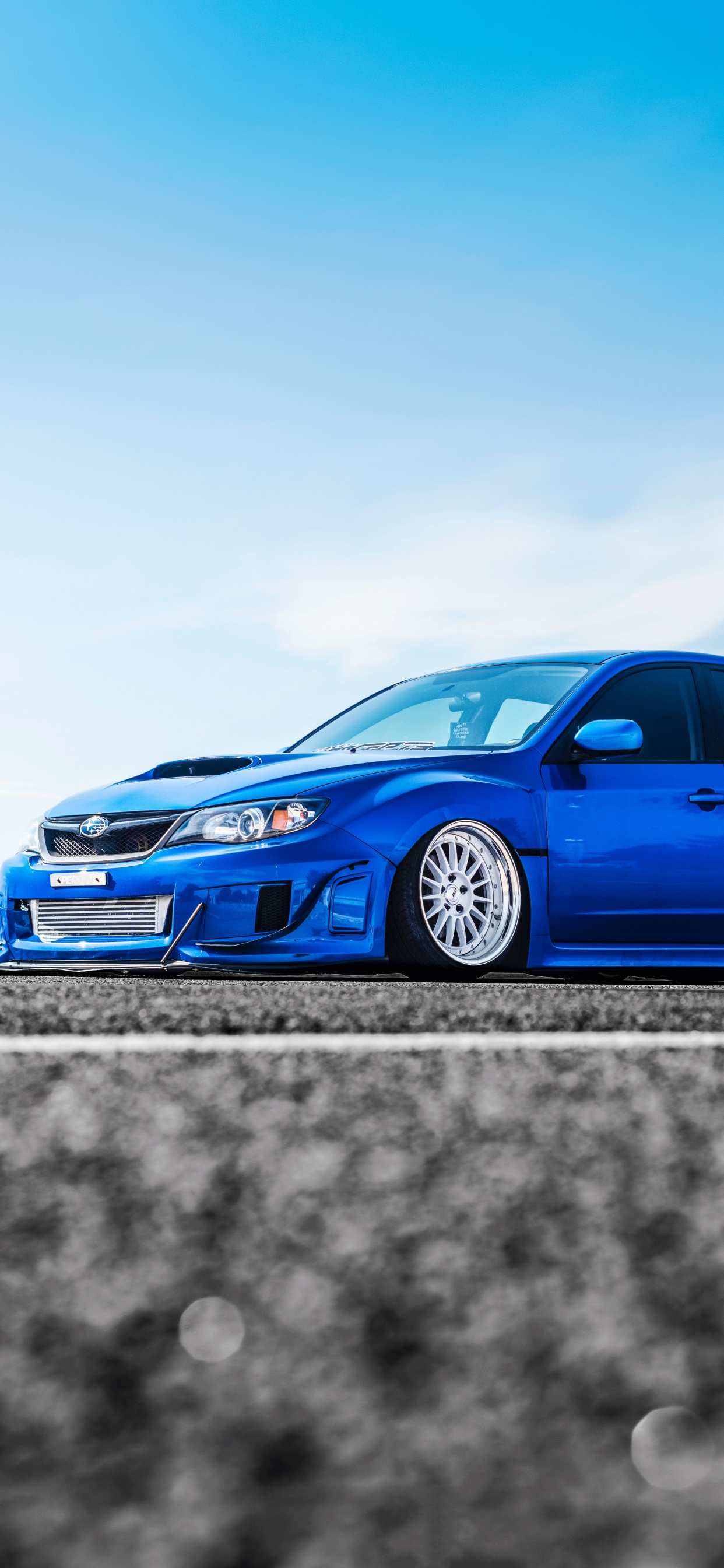 Blue Volkswagen Beetle on Road During Daytime. Wallpaper in 1242x2688 Resolution