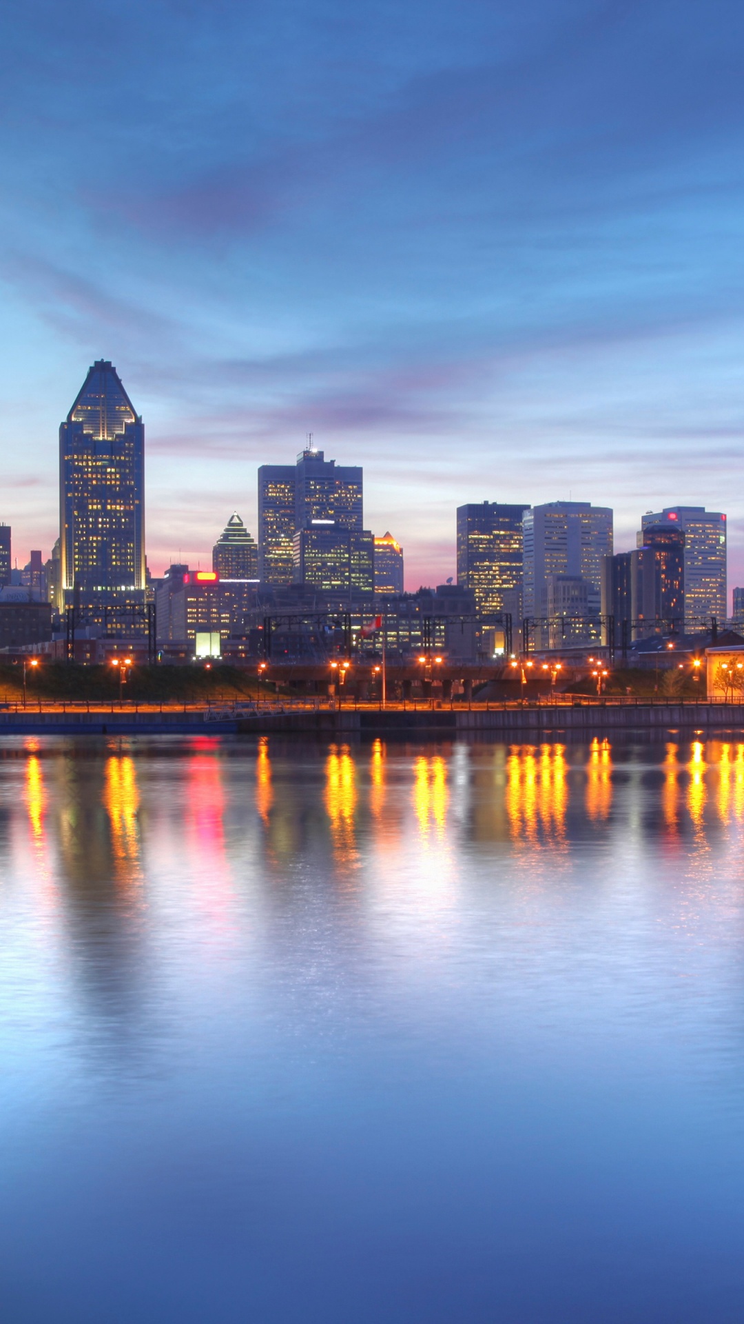 City Skyline Across Body of Water During Night Time. Wallpaper in 1080x1920 Resolution
