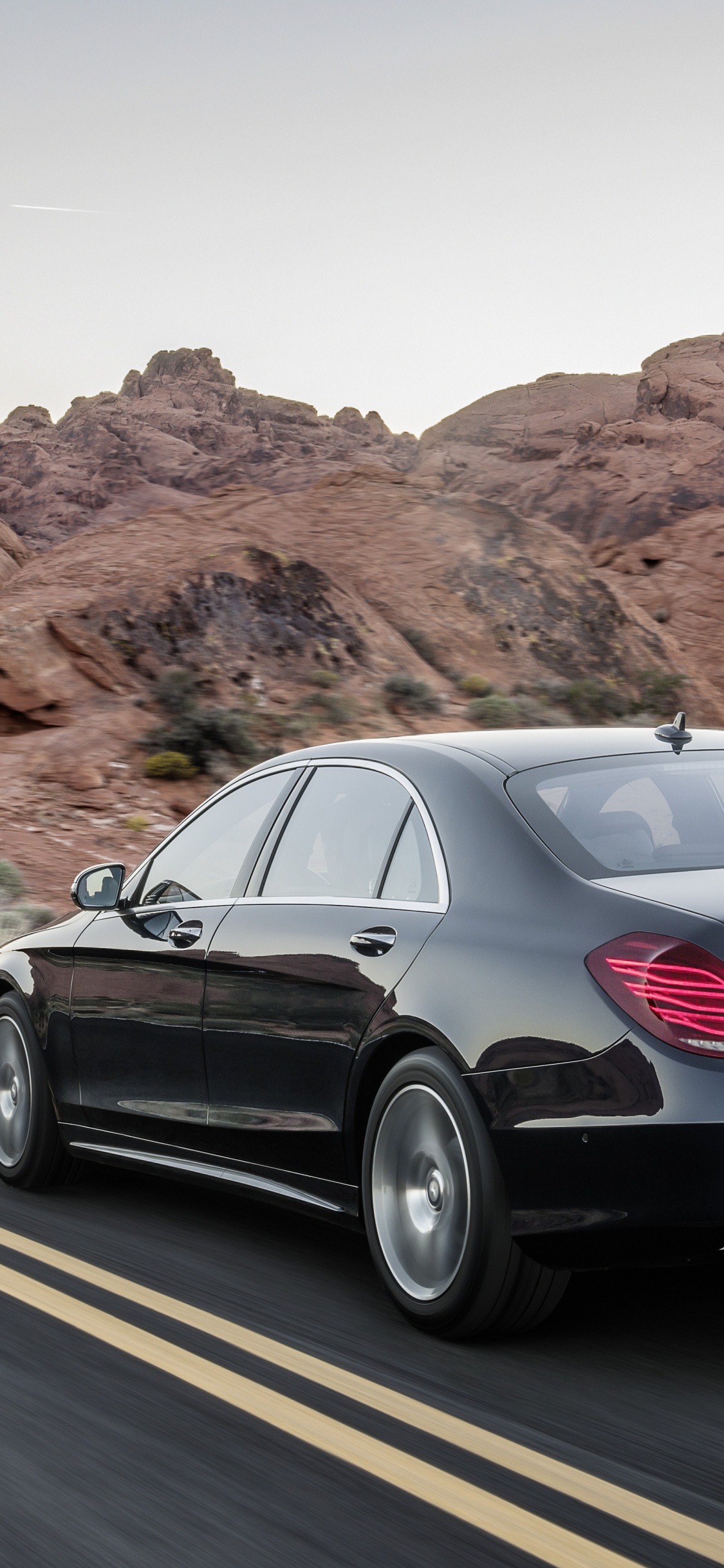 Black Sedan on Road During Daytime. Wallpaper in 1125x2436 Resolution