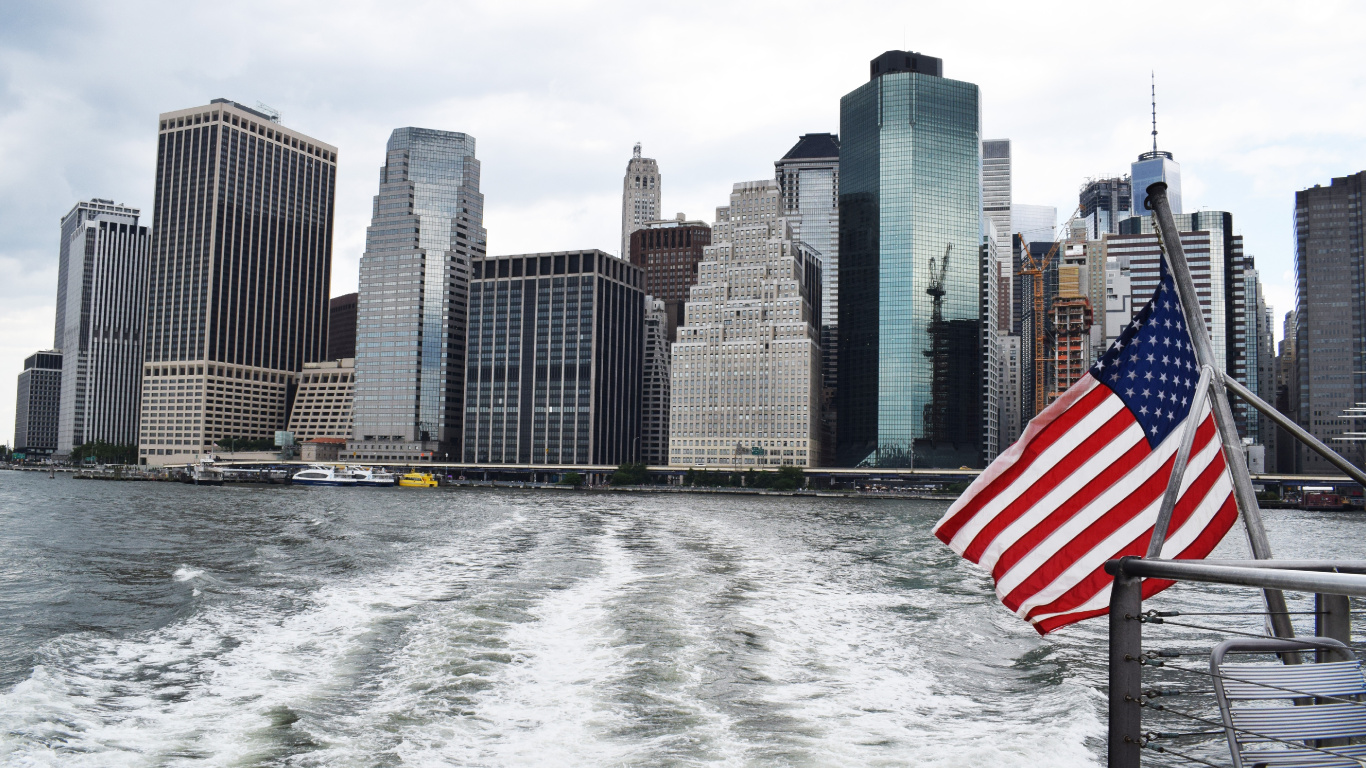 City Skyline Across Body of Water During Daytime. Wallpaper in 1366x768 Resolution