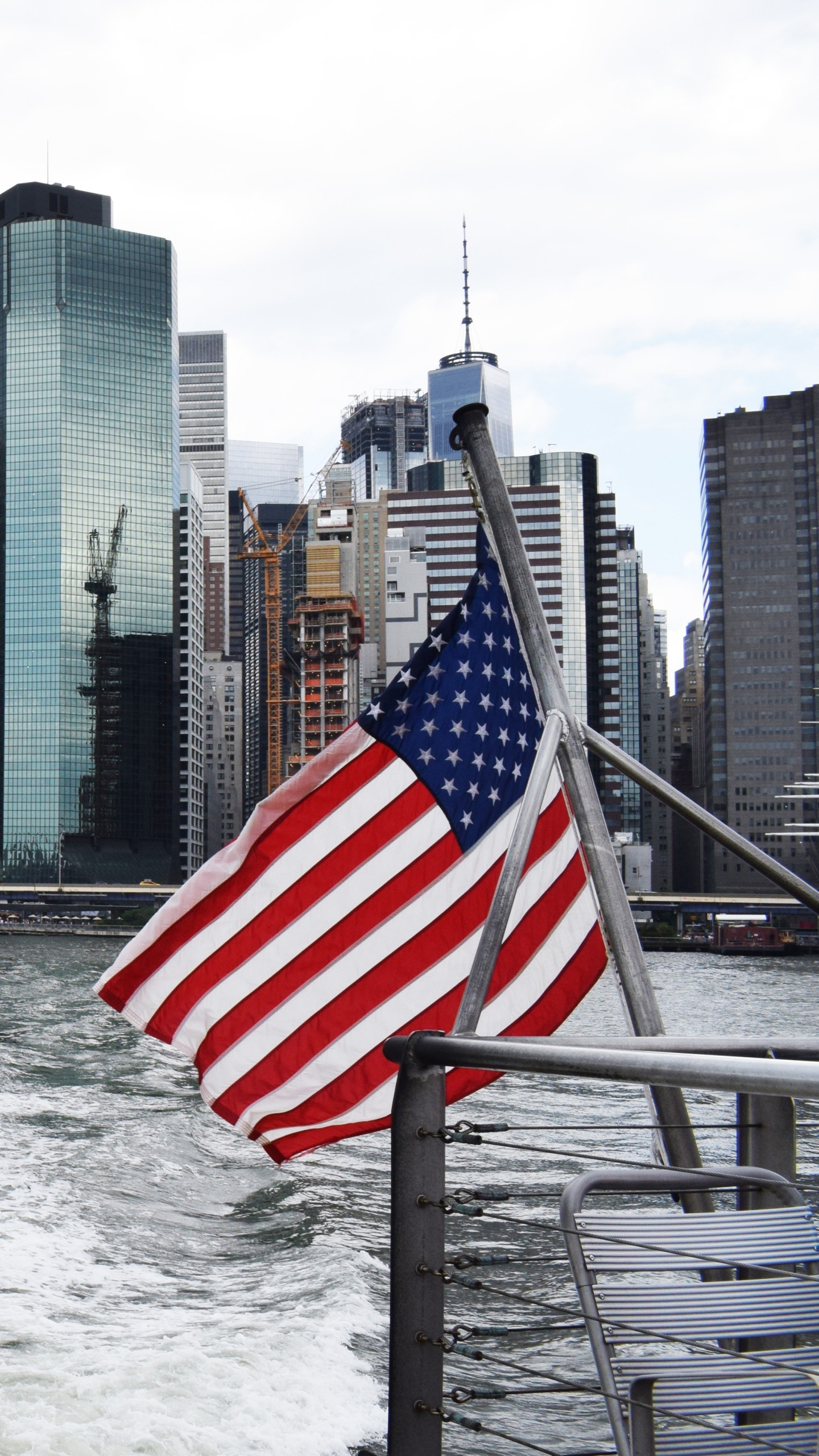 City Skyline Across Body of Water During Daytime. Wallpaper in 1440x2560 Resolution