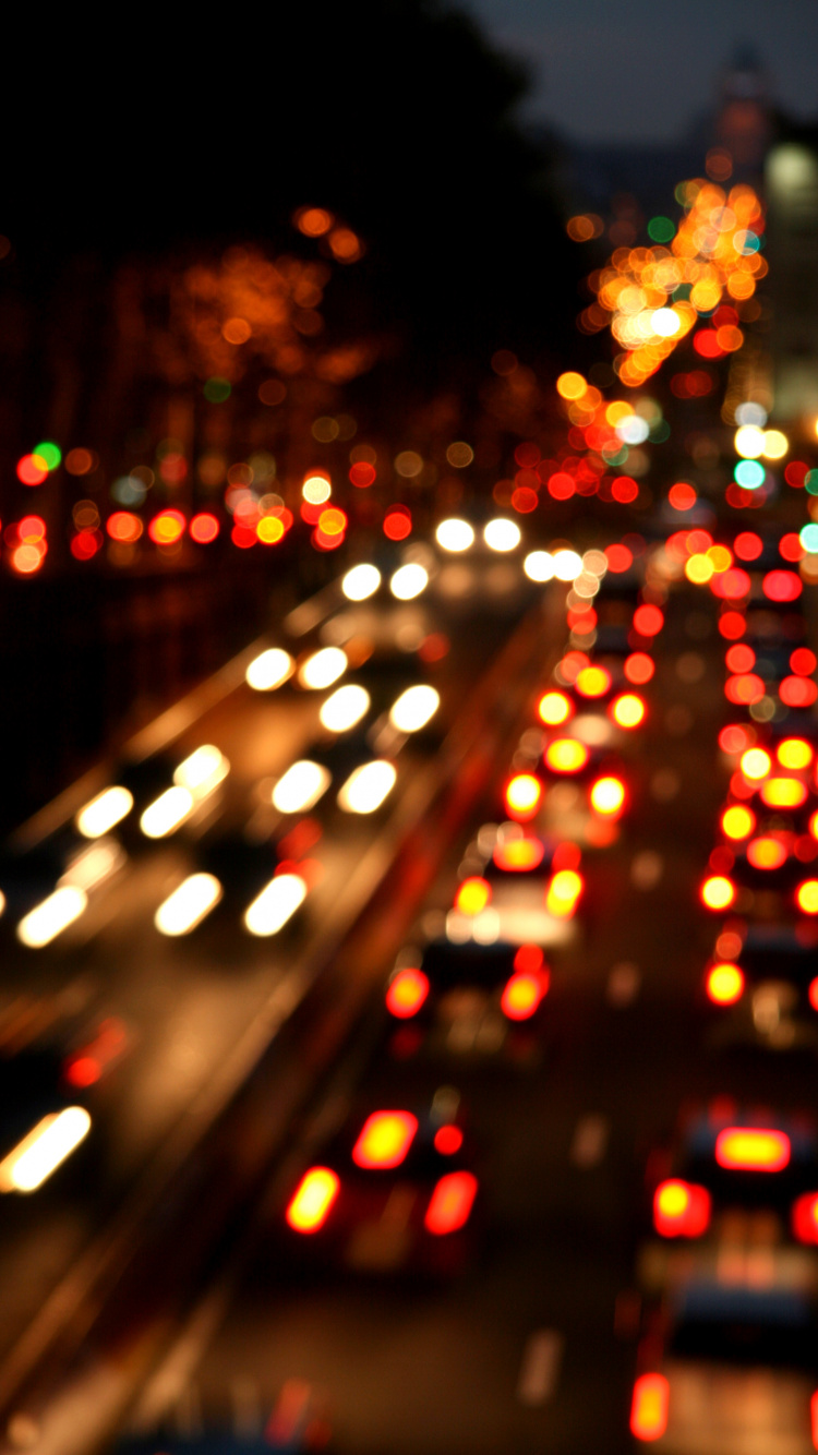 Bokeh-Fotografie Der Lichter Der Stadt Während Der Nacht. Wallpaper in 750x1334 Resolution