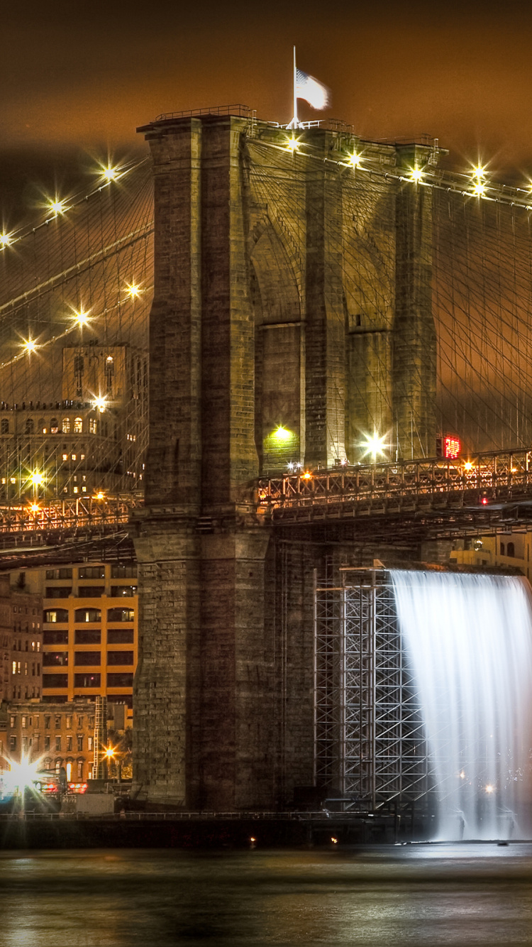 Lighted Bridge Near City Buildings During Night Time. Wallpaper in 750x1334 Resolution