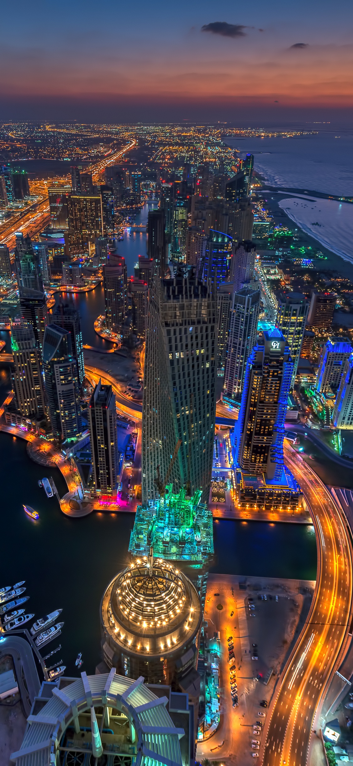 Aerial View of City During Night Time. Wallpaper in 1125x2436 Resolution