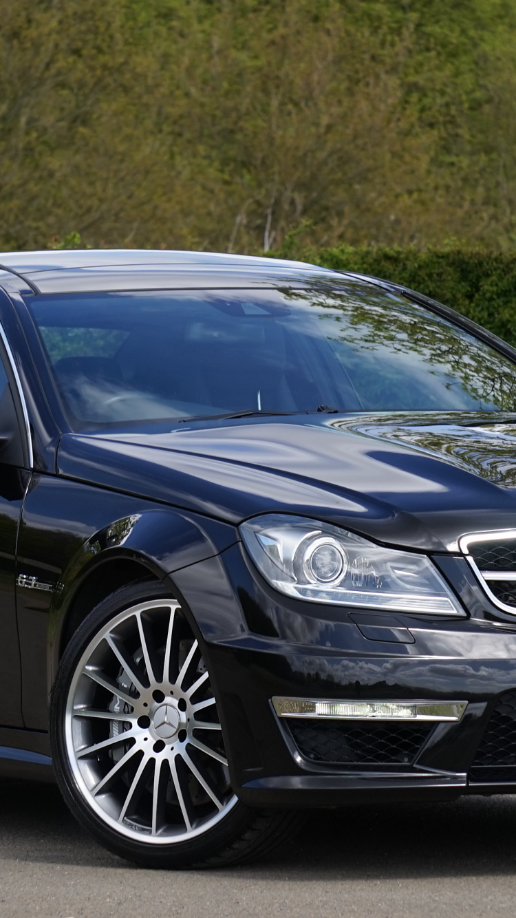Black Mercedes Benz Coupe on Road During Daytime. Wallpaper in 750x1334 Resolution