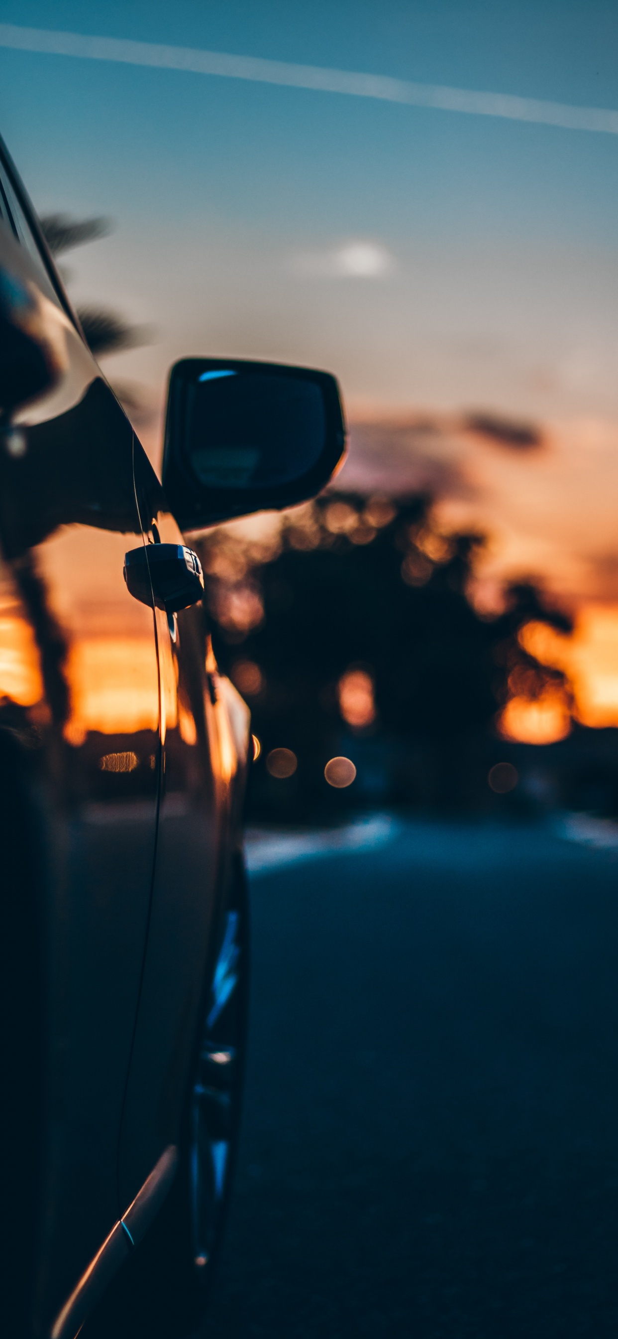Rétroviseur de Voiture Noir Pendant le Coucher du Soleil. Wallpaper in 1242x2688 Resolution
