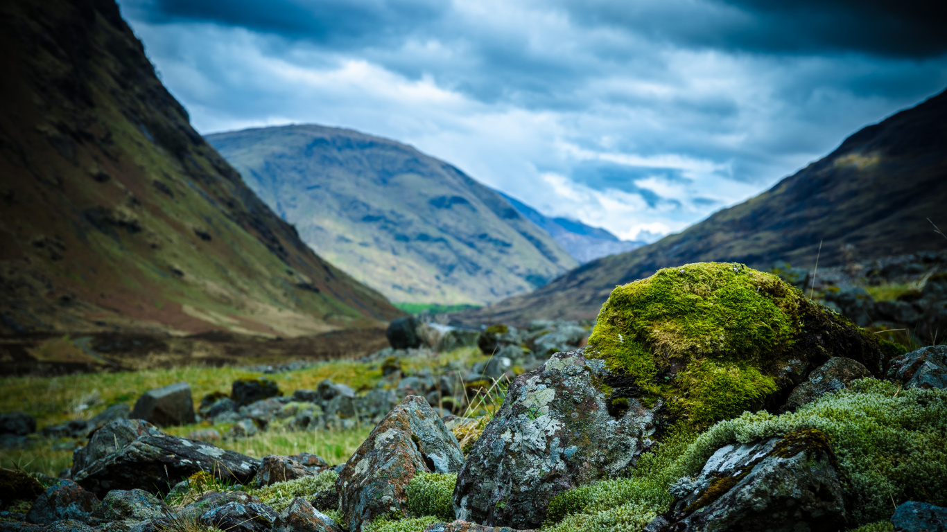 Green Grass Field Near Mountain Under White Clouds During Daytime. Wallpaper in 1366x768 Resolution