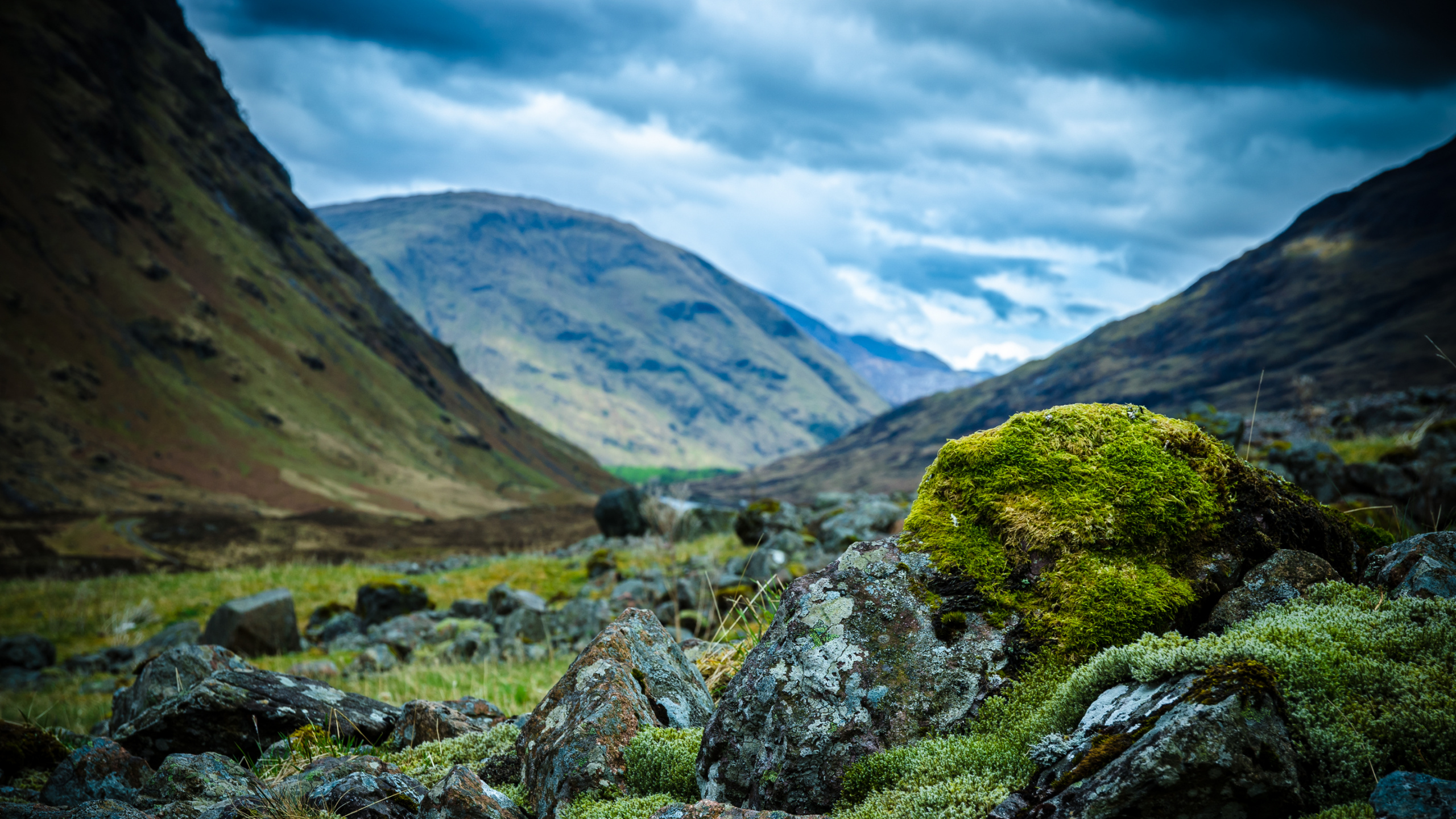 Green Grass Field Near Mountain Under White Clouds During Daytime. Wallpaper in 2560x1440 Resolution