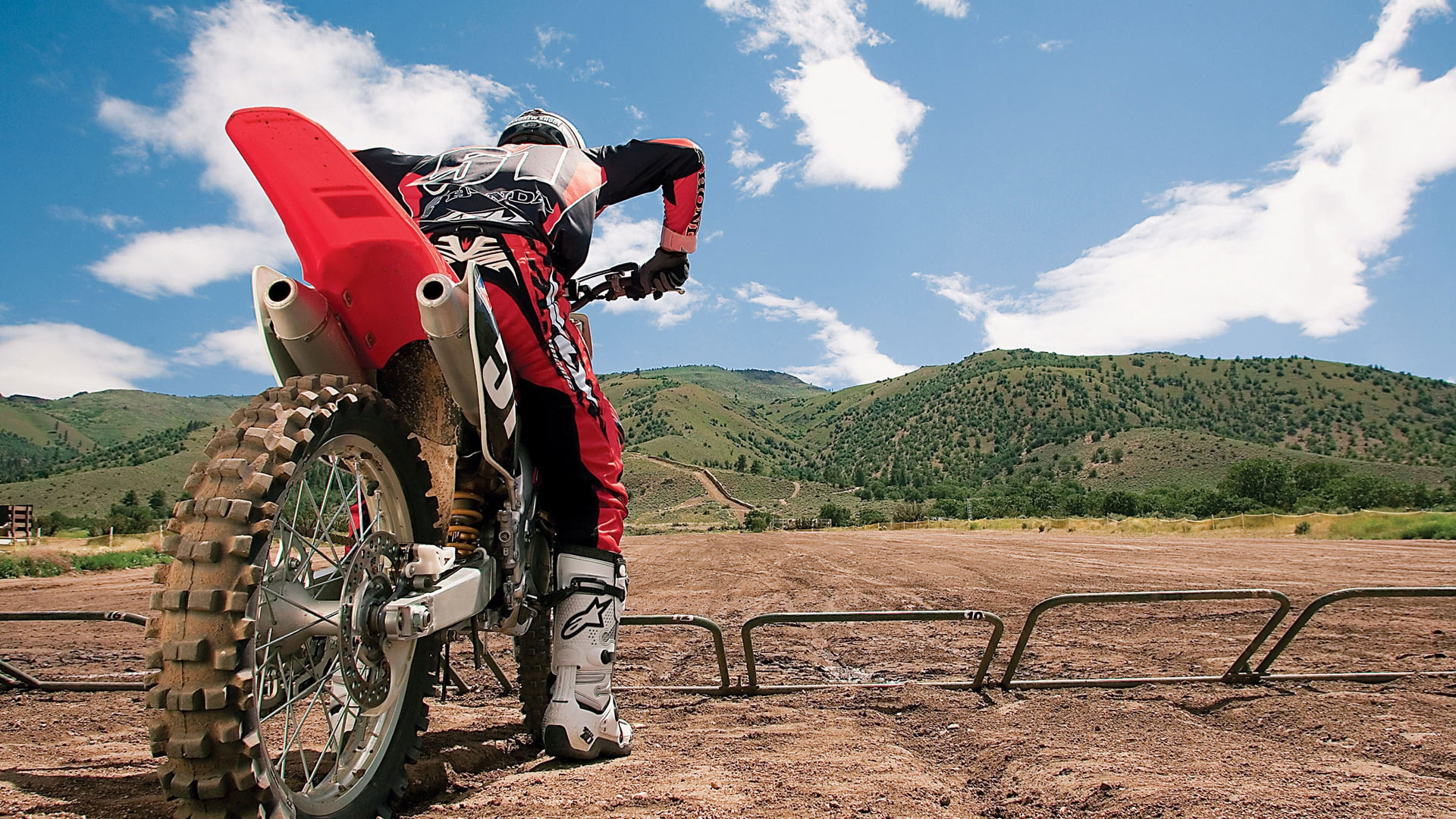 Man in Red Jacket and Brown Pants Riding on Red and White Motorcycle During Daytime. Wallpaper in 1920x1080 Resolution
