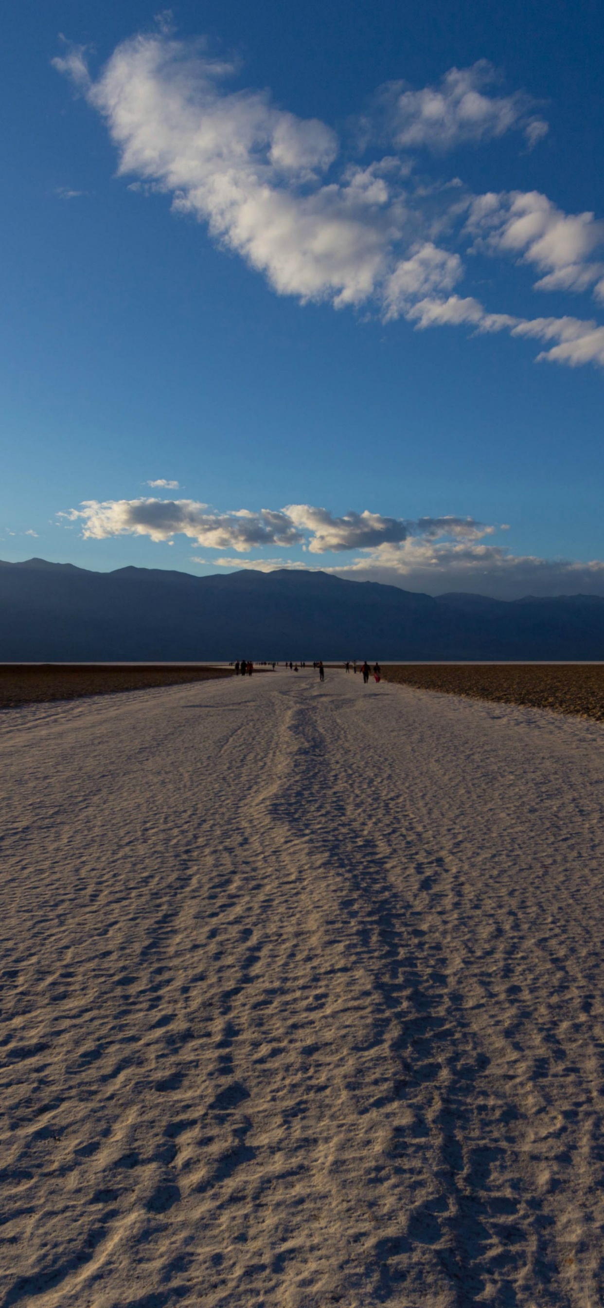 Brown Sand Under Blue Sky During Daytime. Wallpaper in 1242x2688 Resolution