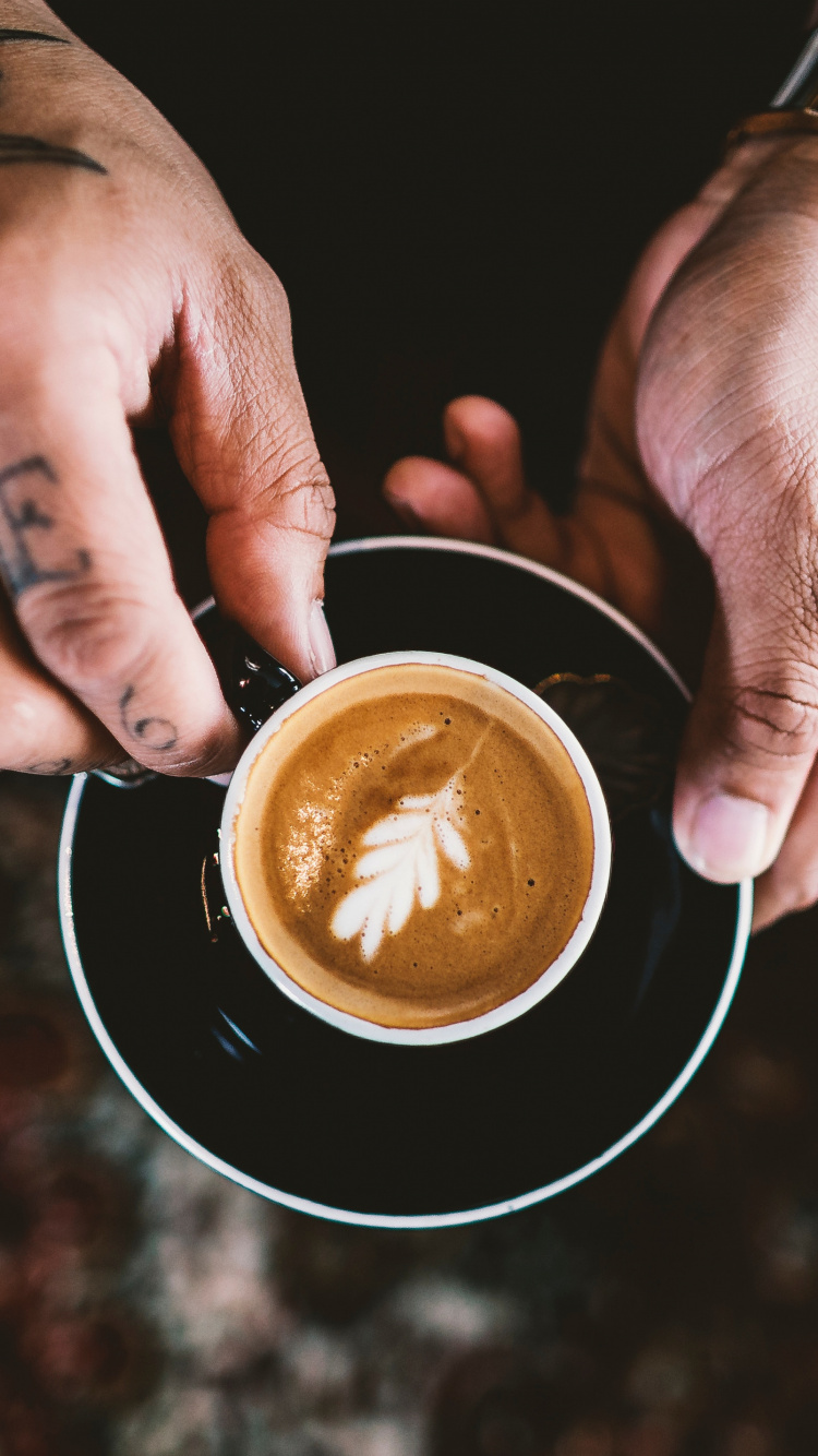 Person Holding Black Ceramic Mug With Brown Liquid. Wallpaper in 750x1334 Resolution