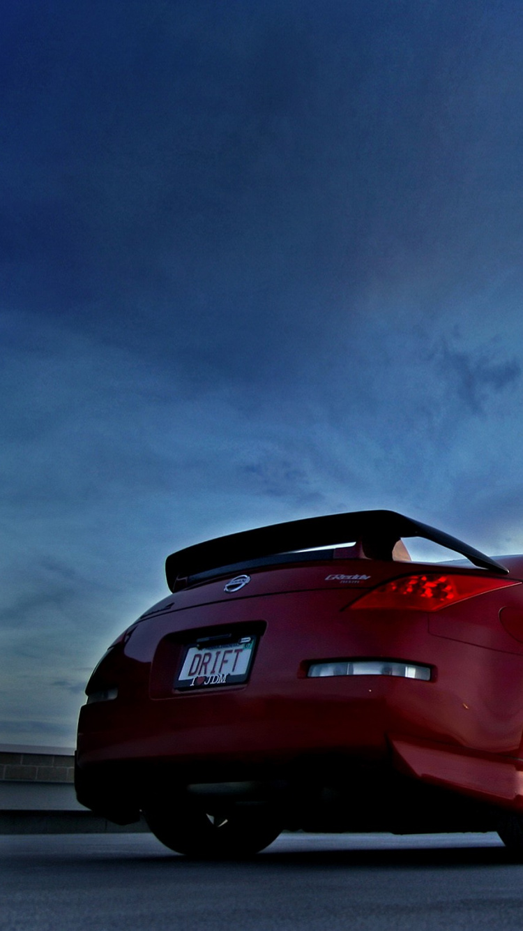 Red Porsche 911 on Road. Wallpaper in 750x1334 Resolution
