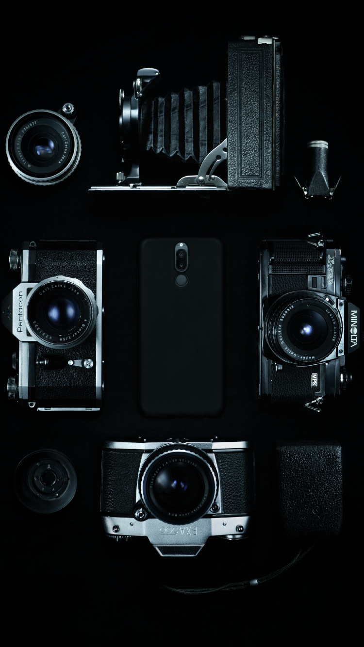 Schwarzes Und Silbernes Kameralos. Wallpaper in 750x1334 Resolution