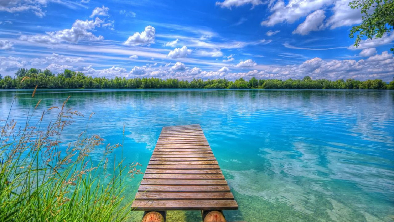 Brown Wooden Dock on Lake Under Blue Sky and White Clouds During Daytime. Wallpaper in 1280x720 Resolution