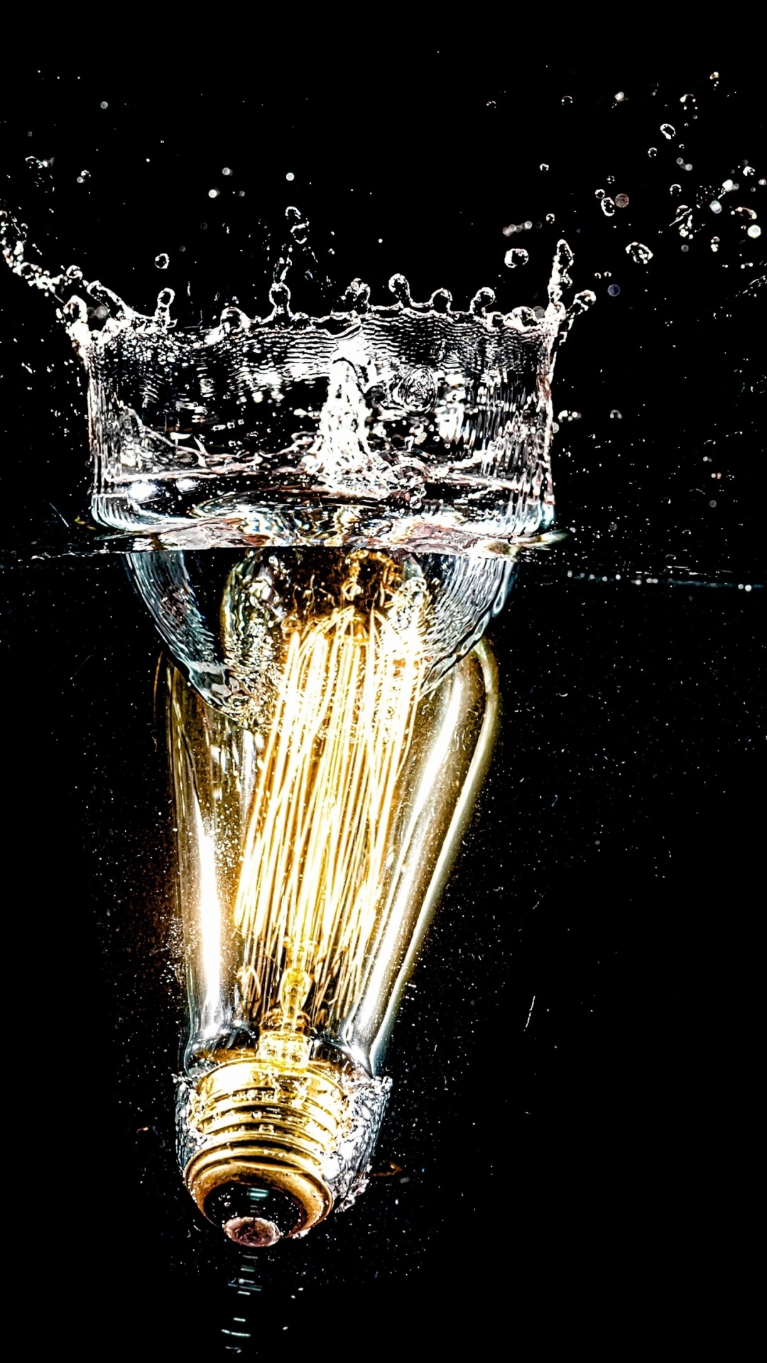 Gold Water Fountain in Black Background. Wallpaper in 1080x1920 Resolution