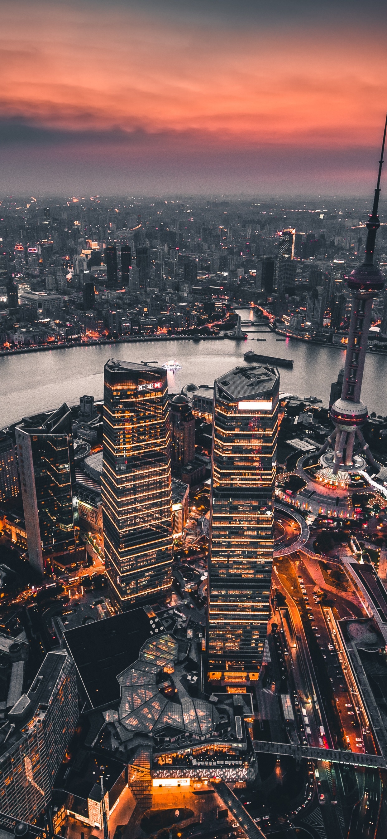 Aerial View of City During Sunset. Wallpaper in 1242x2688 Resolution