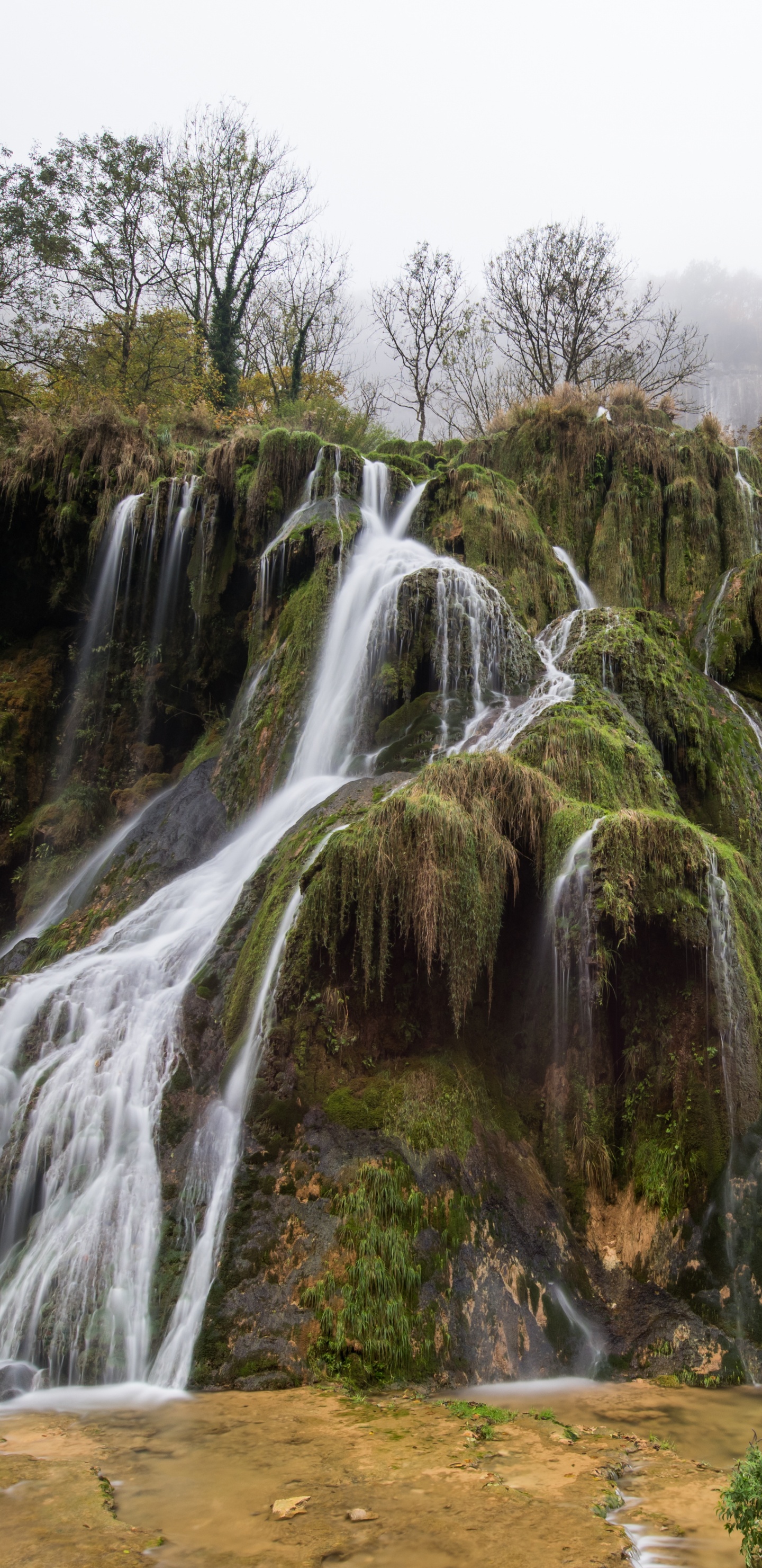 Waterfalls on Brown Rocky Mountain During Daytime. Wallpaper in 1440x2960 Resolution