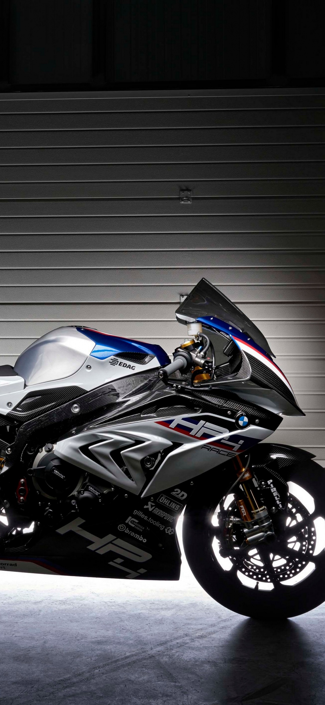 Black and Silver Sports Bike. Wallpaper in 1125x2436 Resolution