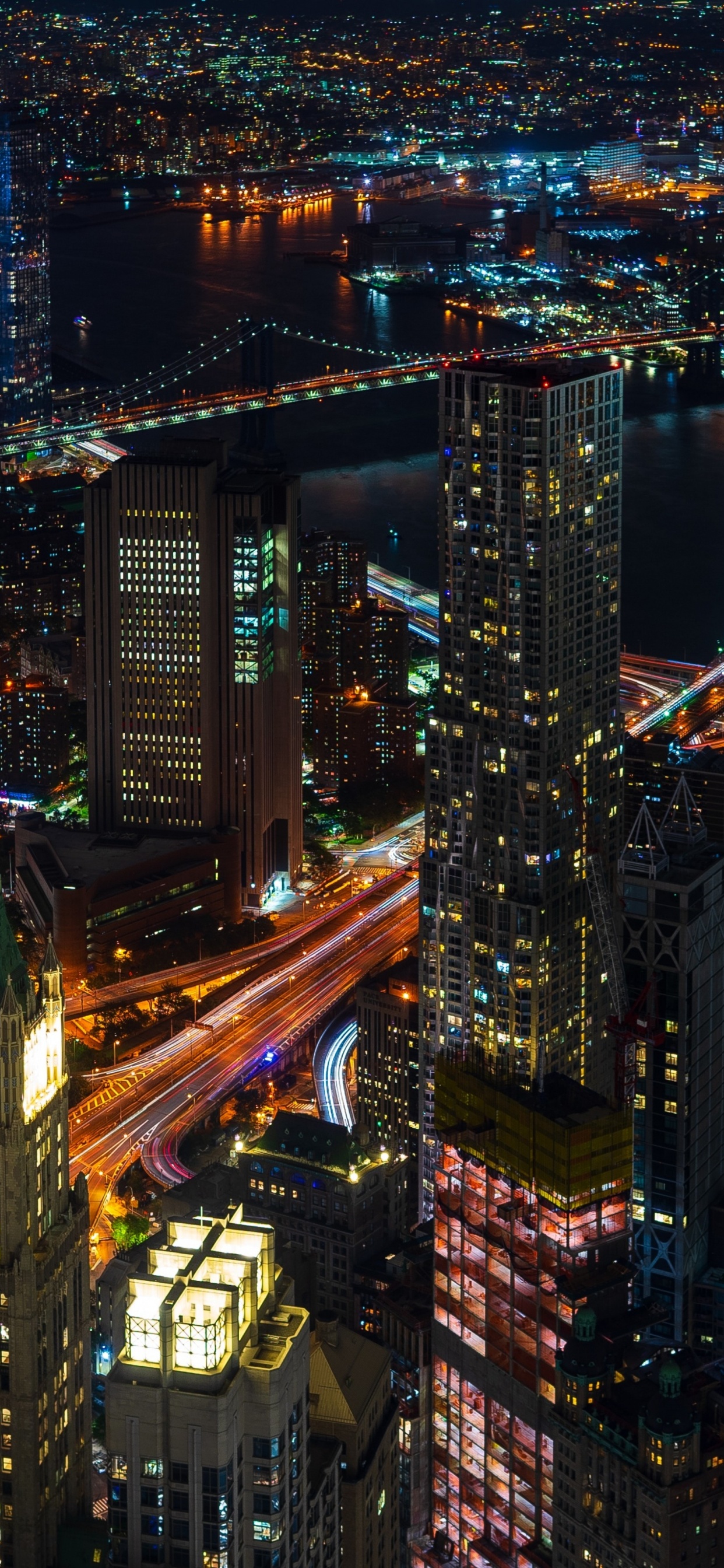 Aerial View of City Buildings During Night Time. Wallpaper in 1242x2688 Resolution