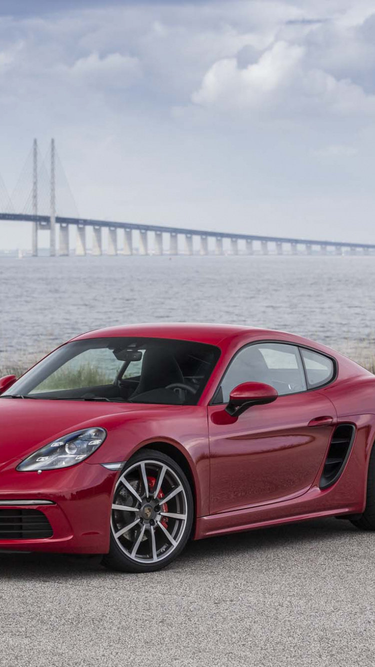 Ferrari 458 Italia Rojo en la Carretera de Hormigón Gris Cerca Del Puente Durante el Día. Wallpaper in 750x1334 Resolution