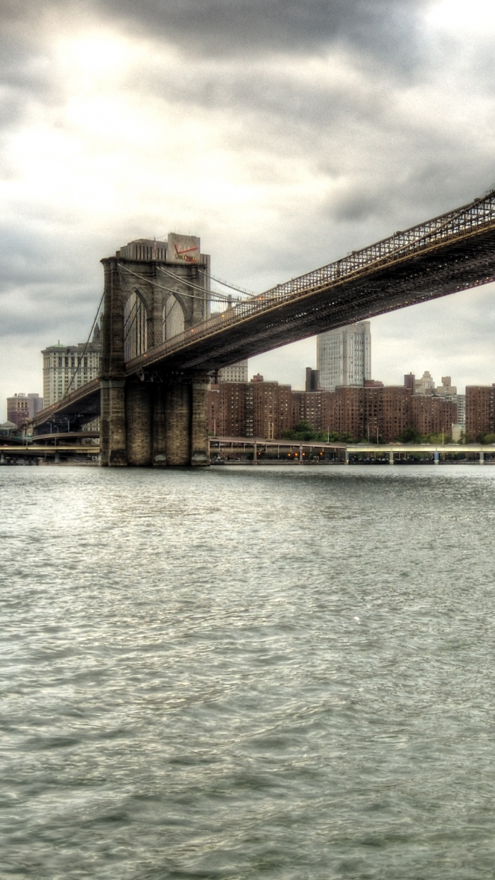 Brown Bridge Over Body of Water During Daytime. Wallpaper in 720x1280 Resolution