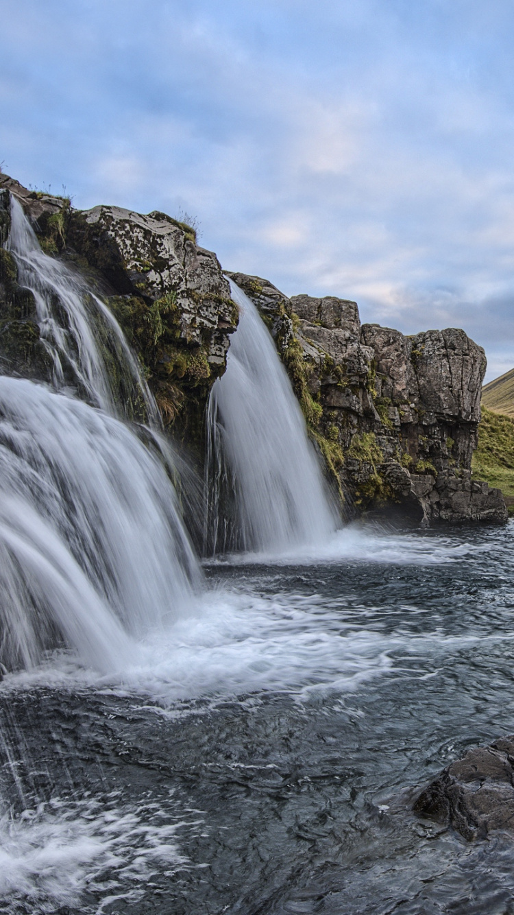 Waterfalls Near Brown and Green Mountain Under White Clouds and Blue Sky During Daytime. Wallpaper in 750x1334 Resolution