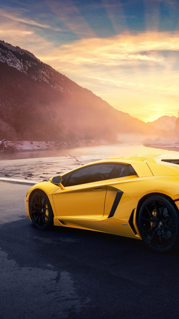 Yellow Lamborghini Aventador on Gray Sand Near Body of Water During Daytime. Wallpaper in 750x1334 Resolution