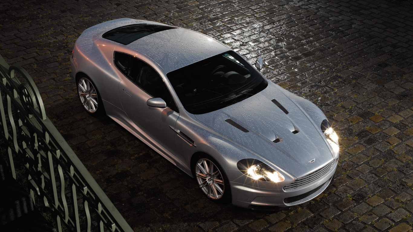 Silver Porsche 911 Parked on Gray Pavement. Wallpaper in 1366x768 Resolution