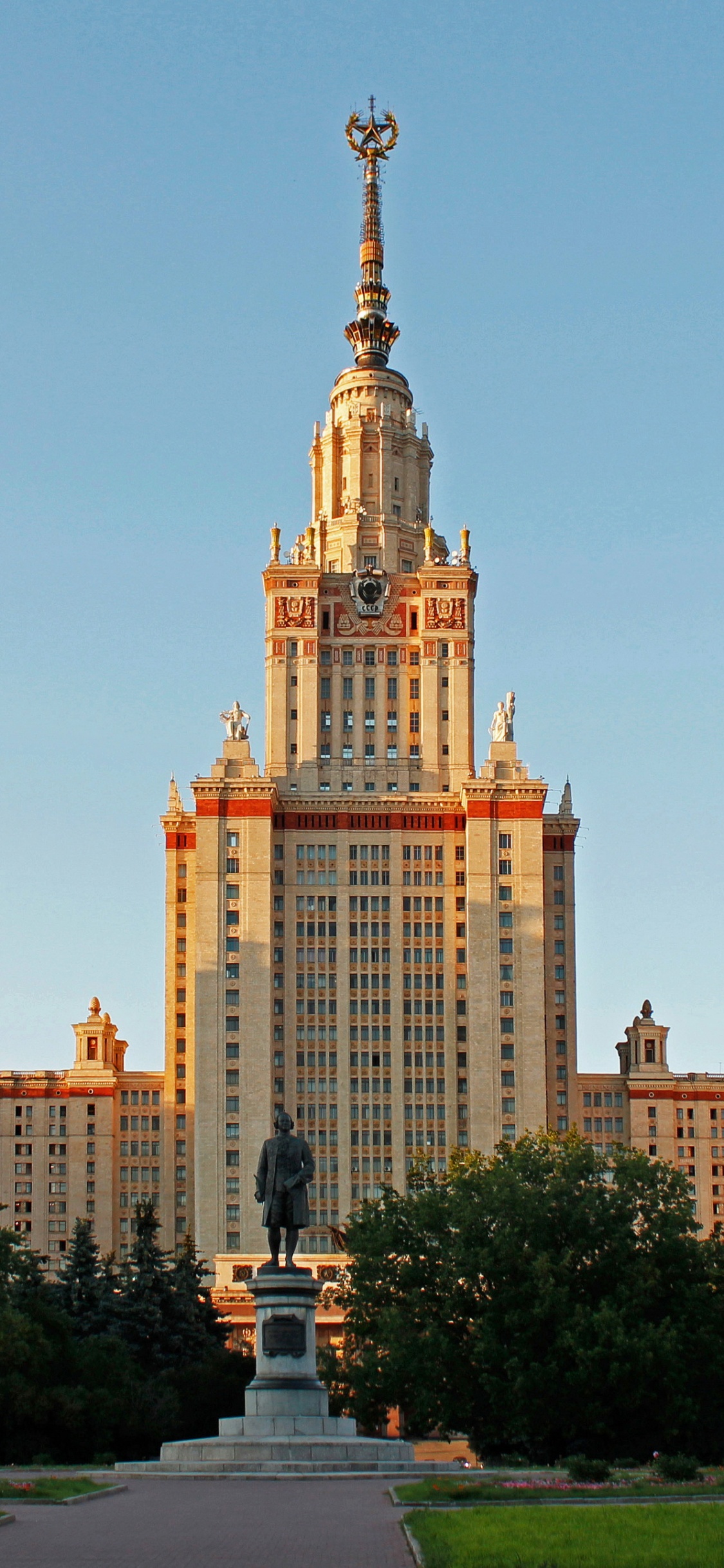 Brown Concrete Building During Daytime. Wallpaper in 1125x2436 Resolution
