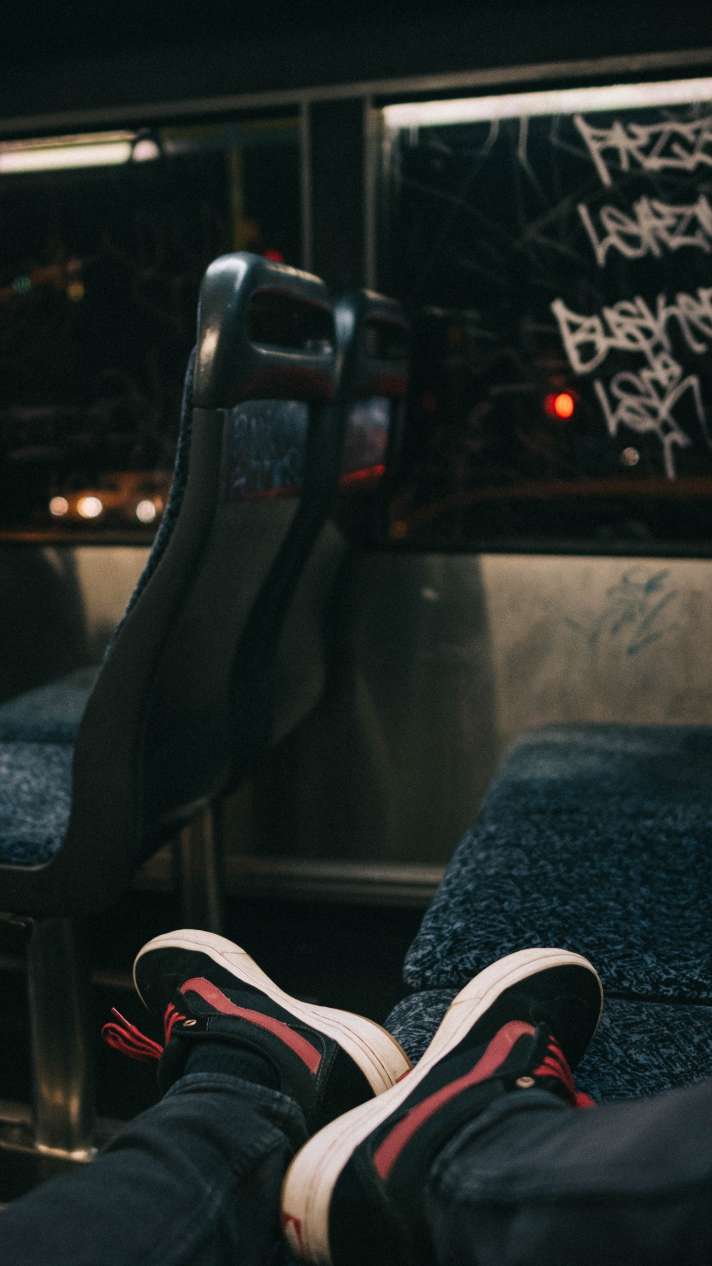 Person Wearing Black and Red Nike Athletic Shoes. Wallpaper in 1440x2560 Resolution