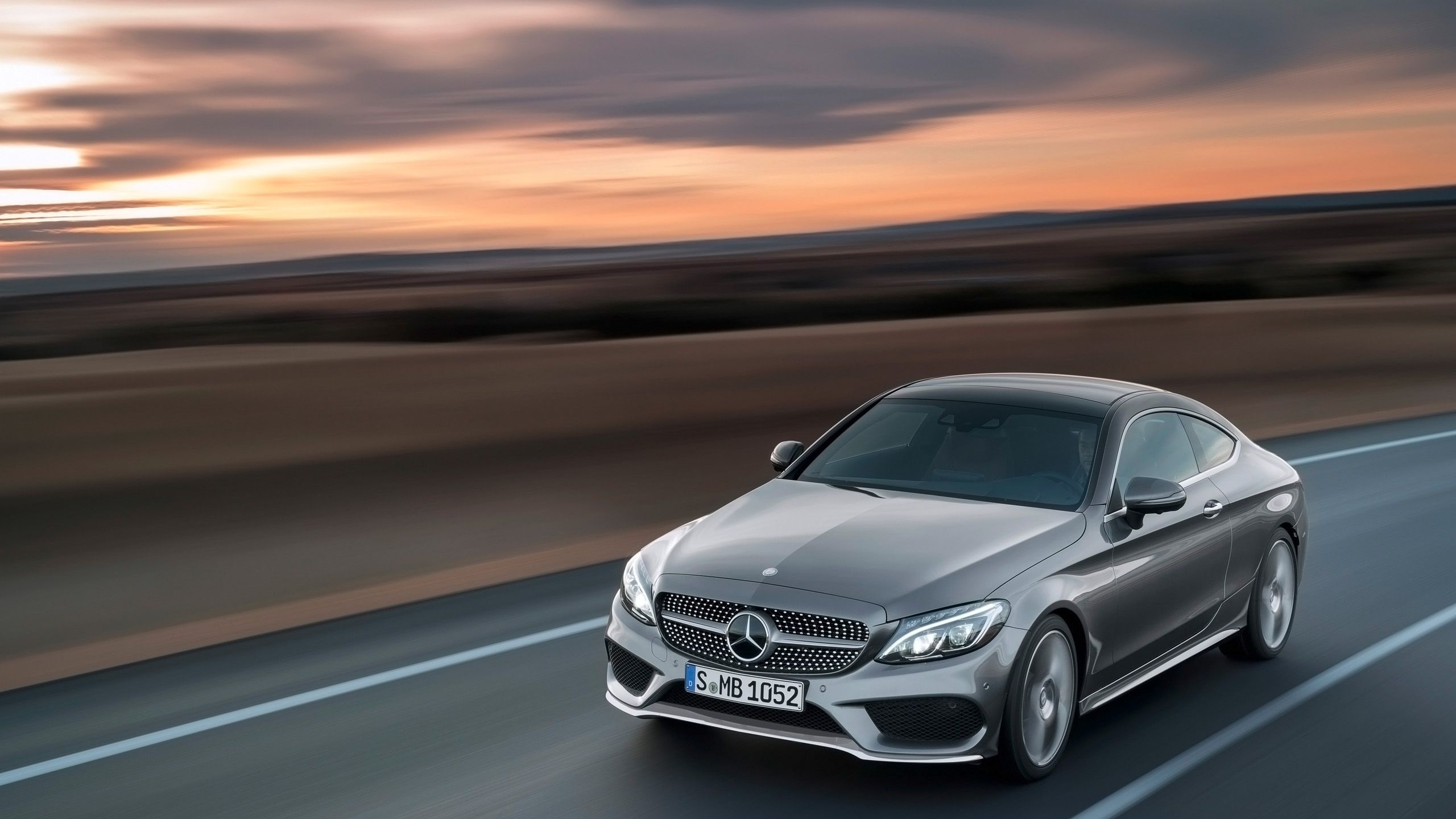 Silver Mercedes Benz Coupe on Road. Wallpaper in 2560x1440 Resolution